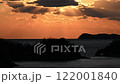 Time lapse of the sun setting over the sea 122001840