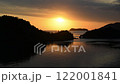 Time lapse of the sun setting over the sea 122001841