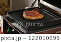 Grilled meat on the grill, close up	 122010695
