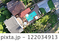 Top View of a Man swimming alone in the luxury villa swimming pool. Aerial top view of floating man. Careless summer vacation concept image 122034913