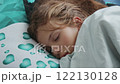 Girl sleeping in bed in the morning 122130128