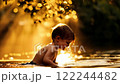 Golden Hour: Child Plays in Stream 122244482