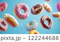 Assorted Donuts Falling on Blue 122244688