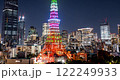 Close up Timelapse of Tokyo Tower lights glowing amid a dynamic city skyline 122249933