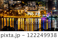 Perth Quay waterfront shines with reflections, streetlights, purple-lit bridge 122249938