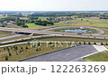 Aerial view of a highway interchange in a rural area of Poland with surrounding greenery 122263269