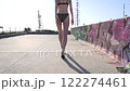 back view of woman walking wearing underwear on an empty building roof 122274461