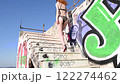 back view of woman wearing underwear climbing stairs in abandoned building 122274462