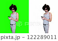 Man Taking Phone Photo on Green Background 122289011