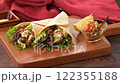 Tortilla, taco, octopus, mexican food. Vegetable rolls with beef and salsa sauce, with avocado. 122355188