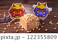 Setsubun, demon mask and beans in a wooden box 122355809