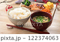 A Japanese meal image with one plate of side dishes such as teriyaki chicken and stir-fried spinach. Rice and miso soup are also included. 122374063