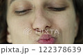 Closeup of a woman face grimace and emotion of discontent 122378639
