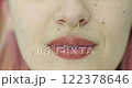 Closeup of girl showing off nose piercing 122378646