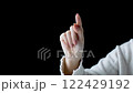 Make a writing gesture with your index finger 122429192