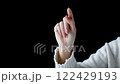 Make a writing gesture with your index finger 122429193