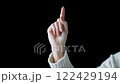 Make a writing gesture with your index finger 122429194