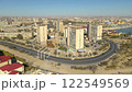 AKTAU, KAZAKHSTAN - FEBRUARY 1, 2025: Aerial view of downtown Aktaut showcasing urban development and coastal landscape 122549569