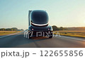 Futuristic autonomous electric truck on a future highway during the nighttime with informatiove leds lit up. 122655856