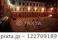 Evening scene in historical courtyard with visitors 122709189