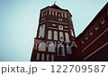 Historic brick tower against a dramatic sky 122709587