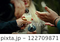 Pouring champagne at outdoor celebration gathering 122709871