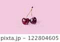 Two ripe cherries on pastel pink background. Cherries glimmering with natural shine, cherries radiating sweet temptation, perfect for brand campaigns or fresh summer promotions 122804605