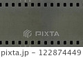 Old celluloid film strip with dust and scratches, 4K retro background 122874449