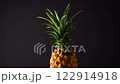 Mini Chiangrai Phulae pineapple fruit on black background. Mini Thai topical pineapple fruit closeup. Whole exotic organic pineapple full of vitamins and minerals. 122914918