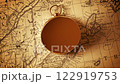 Golden compass on the map indicating direction 122919753