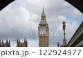 This shot captures an innovative photography angle for tourists in London, using the tunnel arch to frame Big Ben for a striking visual effect.  122924977