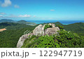 石垣島の絶景を山の頂上から眺める女性のドローン映像 122947719