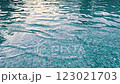 A video showcases a serene pool with turquoise tiles and blue water 123021703