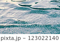 The video captures a serene swimming pool with gentle waves 123022140