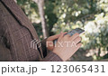 Close up female hands using smartphone shopping online, buying on internet. 123065431