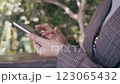 Close up female hands using smartphone shopping online, buying on internet. 123065432
