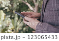 Close up female hands using smartphone shopping online, buying on internet. 123065433