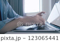 Man holding credit card while using laptop, shopping online, buying on internet. 123065441