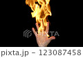 4K - Burning hand on black background. Fire flame at slow motion 123087458