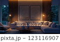 A cozy and dimly lit living room at night features a large, comfortable sectional sofa as the focal point, illuminated by warm, strategically placed lighting that highlights the textured wall 123116907