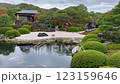 Typical Japanese garden, with tea houses and a pond where Koi carp swim 123159646