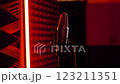 In a Recording Studio, a Microphone stands out with Ambient Lighting  123211351