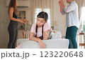 Young girl trapped in the middle of tension by her parent argument. Fastidious 123220648