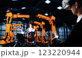 Engineer use cybernated robotic software control industry robot arm in factory 123220944