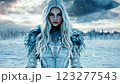 Ice queen warrior posing in snowy landscape 123277543
