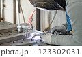 Welder joining metal parts using arc welding equipment 123302031
