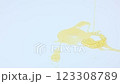 Yellow liquid honey dripping on a white background close-up. The concept of honey, nectar, dessert. High quality 4k footage  123308789