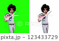 A male barber barbershop cuts with scissors on a green screen 123433729
