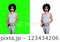 a man erases written text on a green background from a virtual board 123434206