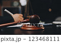 Male lawyer working with contract papers and wooden gavel on tabel in courtroom. justice and law ,attorney, court judge, concept. 123468111
